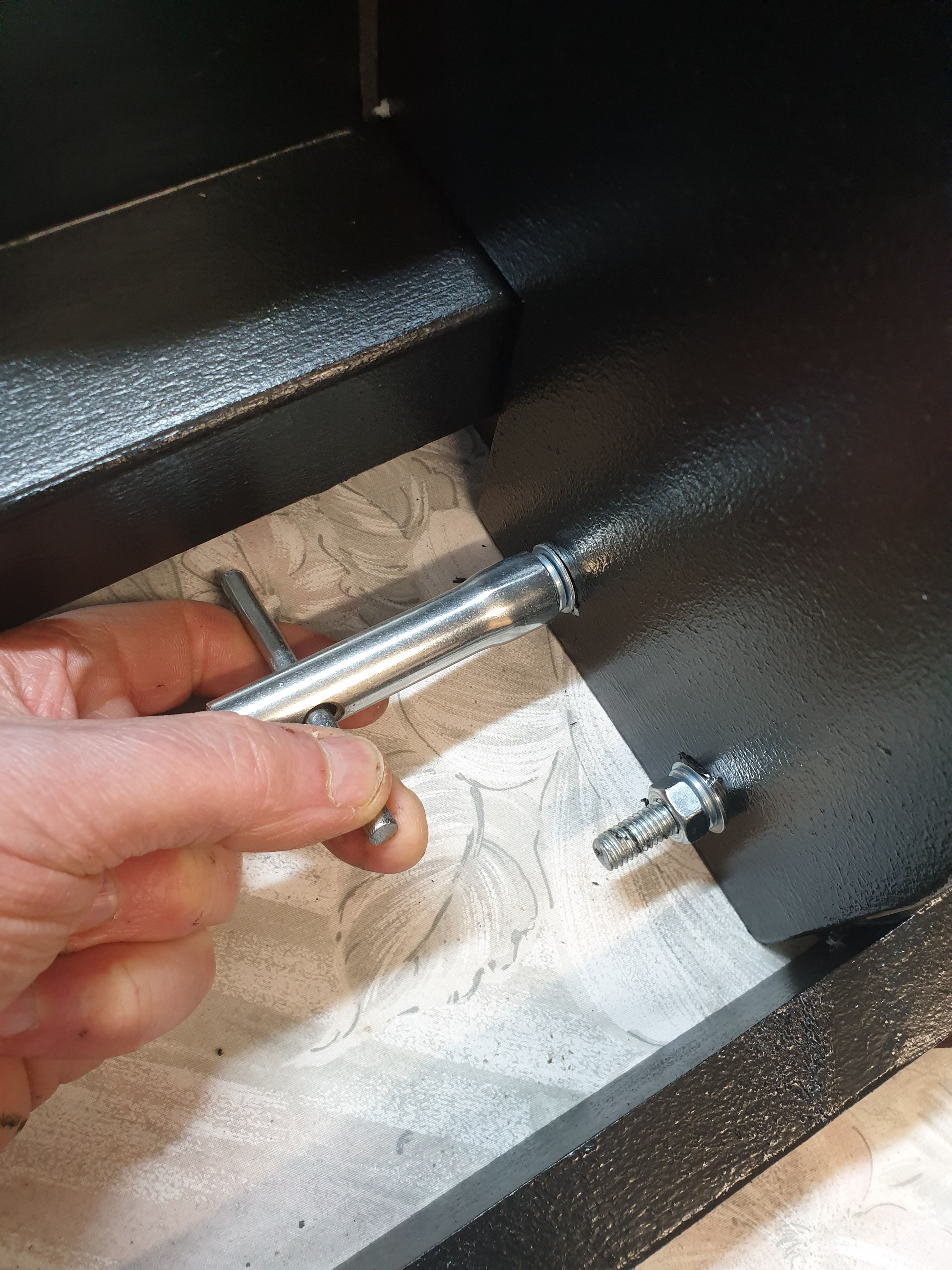 The two fixings at the back of a freestanding wheel base.