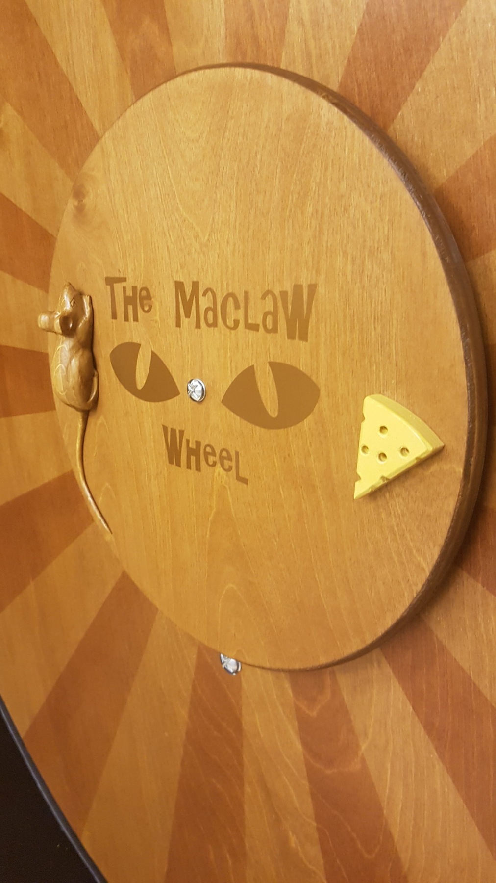 Close-up of the wooden Maclaw Wheel centre cap with its little mouse and cheese detail